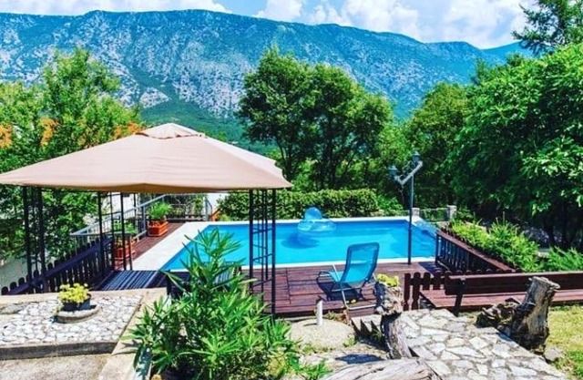 Half of the house in Tribalj with a private pool and a beautiful garden