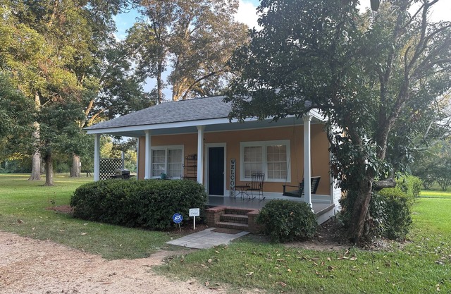 Historic cottage privately situated on the grounds of the Foster Mounds.