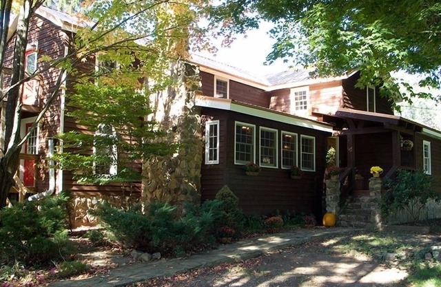 Historic Farmhouse and horsefarm with trail riding and a pond.