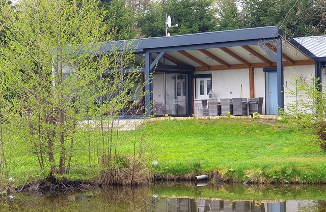 house with pond, mountain view