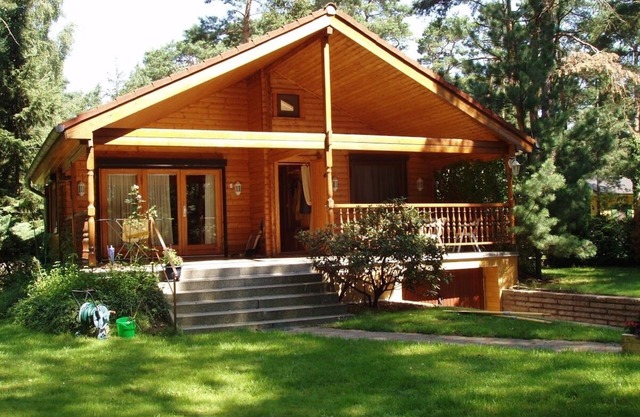 Idyllic wooden dacha with jetty and rowing boat just outside Berlin