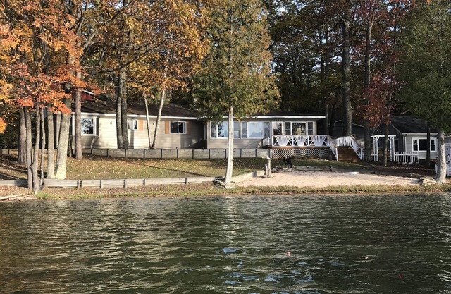 Incredible sunsets await in this Northern Michigan Lake front home.