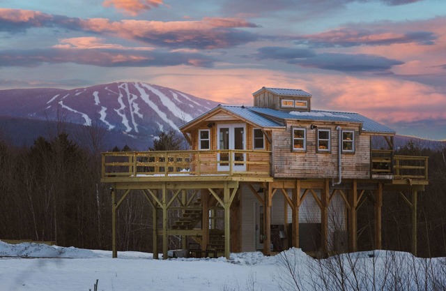 Insanely romantic treehouse perched next to a stream and rolling hills.