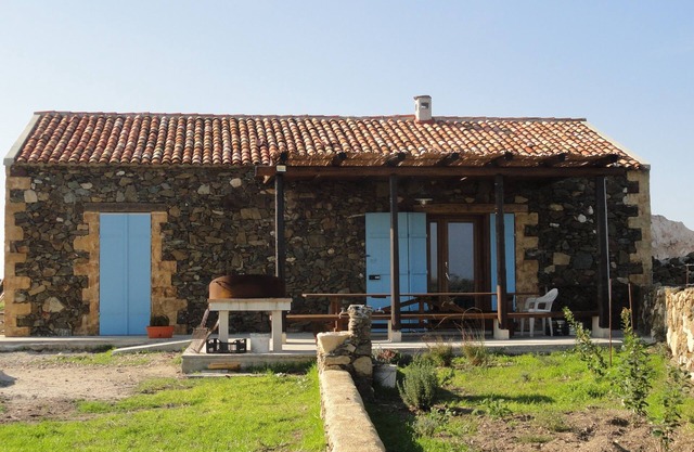 Isolated traditional sheepfold with pool overlooking the countryside. Sea at 500