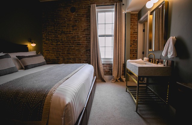 King suite at The Jacksonville Inn Features Tiled Rain Fall Shower