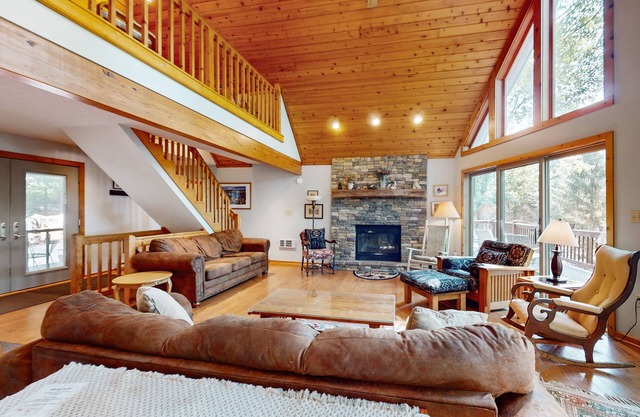 Lake-view home with hot tub, dock, decks, firepit, & AC - near slopes, dogs OK