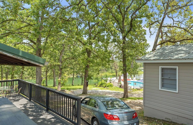 Lakefront 2BR Cabin w/Pool + Swim & Boat dock