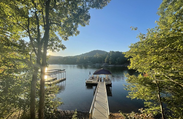 Lakefront home with private hot tub, dock, 2 decks & fireplace
