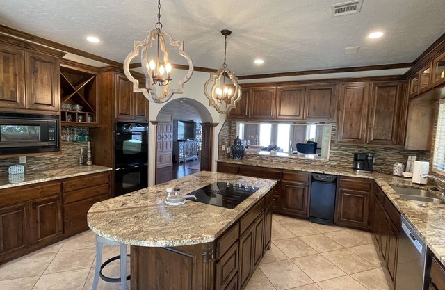 Lakefront home with private dock, great fishing and game room.