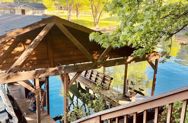 Lakehouse with 3 Decks, 2 Covered Boat Slips & Swim Dock!