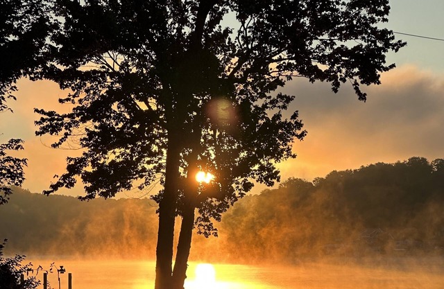 Lakehouse with beautiful setting, public boat launch within walking distance.
