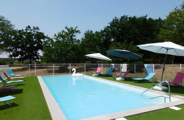 "Les Pins - Domaine Des Landes" with shared pool, covered private terrace, and shared garden