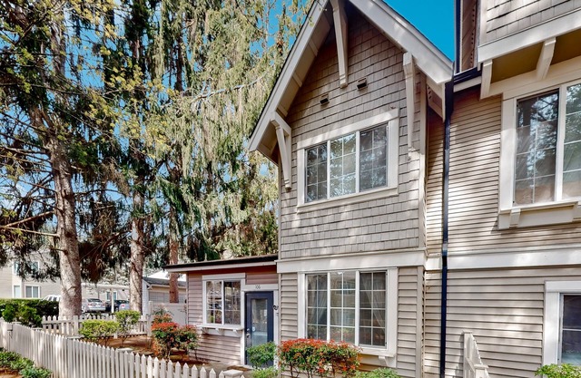 Light-filled corner townhome with deck, home office & convenient location