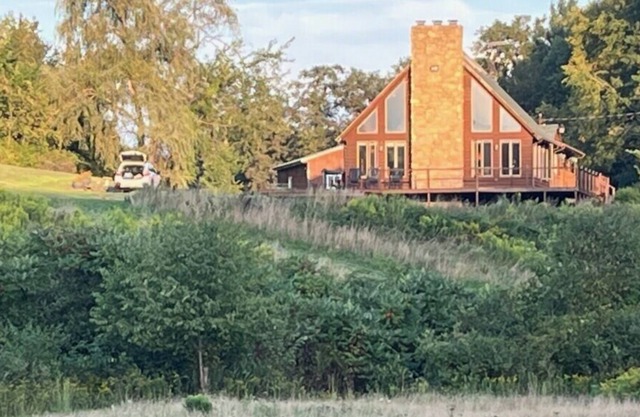 Log cabin style dupex on 155 acres wooded farm land