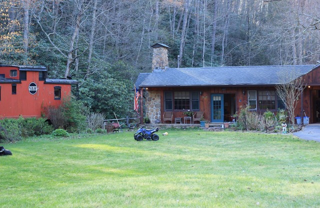 Lovely cottage by stream with caboose and covered bridge over trout stream