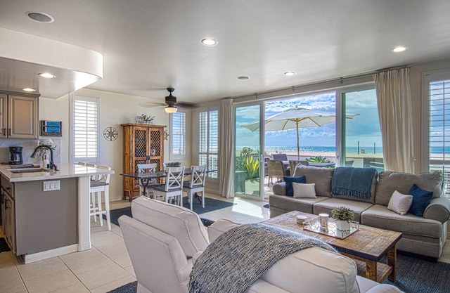 Lovely lower unit with spectacular oversized patio right on the sand!