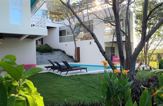 Luxurious villa with private pool, garden and balconies.