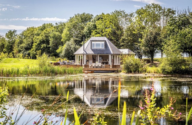 Luxury Boathouse situated on a private lake, with panoramic views and a hot tub.