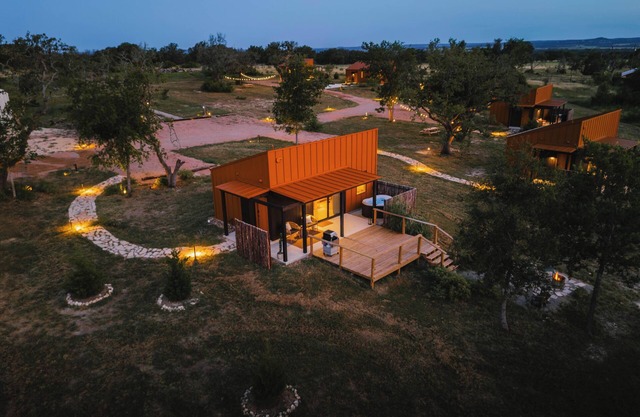 Luxury cabin in the center of the Texas Wine Country; large private porch w/hot tub, gas grill and fire pit; pet friendly