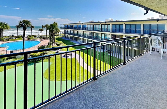 Luxury Condo with Balcony, Ocean View, Pool and Just Steps to the Beach