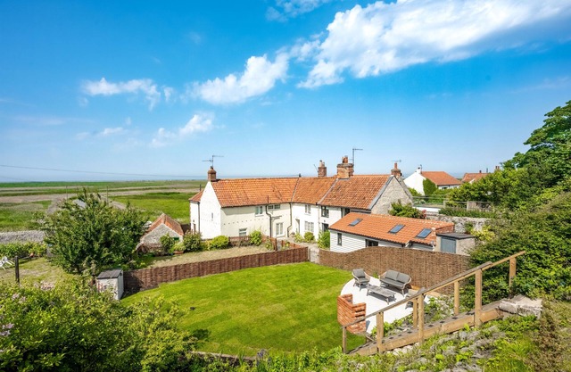 Luxury Cottage with Stunning Panoramic Views of Coastline from gardens.