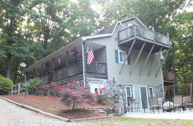 Luxury & Tranquility on 8 Acres Bordering Brush Creek! Secluded 3-level home.