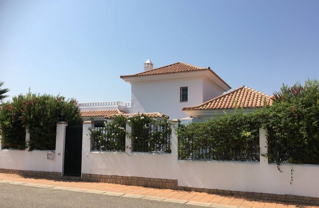 Luxury villa with private pool overlooking golf course, close to beach