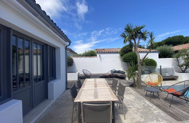 Luxury villa with heated pool close to shops and sea.