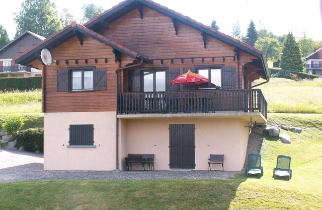 Magnificent Chalet seen from the lake near the quiet ski slopes 4 people