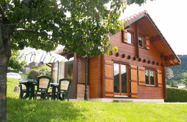 Magnificent Chalet seen from the lake near the quiet ski slopes 4 people