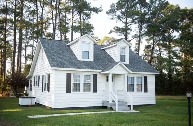 Mid-century modern meets classic cape on the coast. n