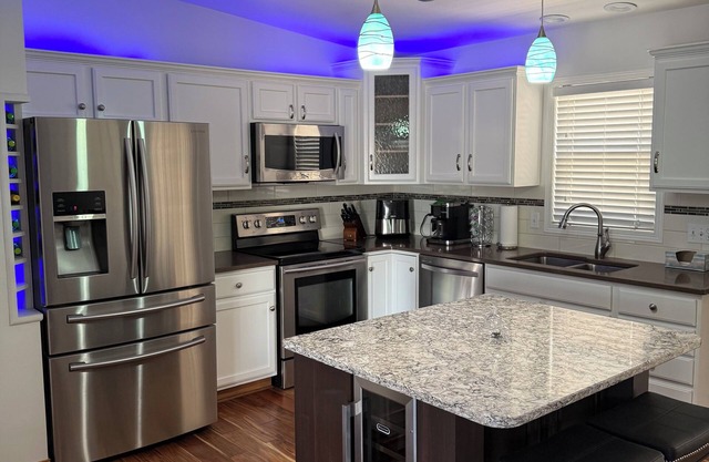 Modern 3-bedroom, 3 full bath, 2 living areas, 2 kitchens, game room, hot tub!