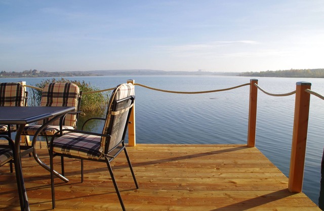 Modern holiday home directly in Hainer lake with boat
