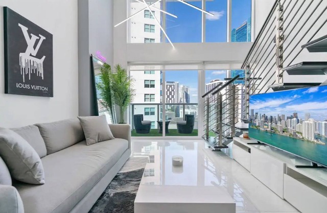 Modern luxury loft with water and city views