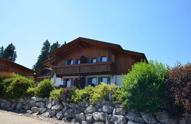 Modern vacation home in Lechbruck am See with fireplace, balcony and garden