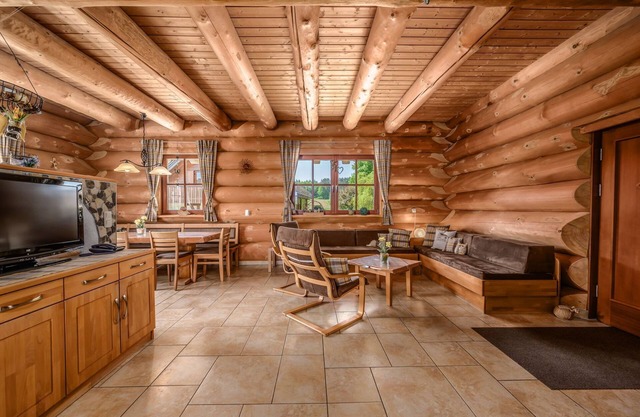 Natural log house Morgensonne - Heumann's log houses by the forest