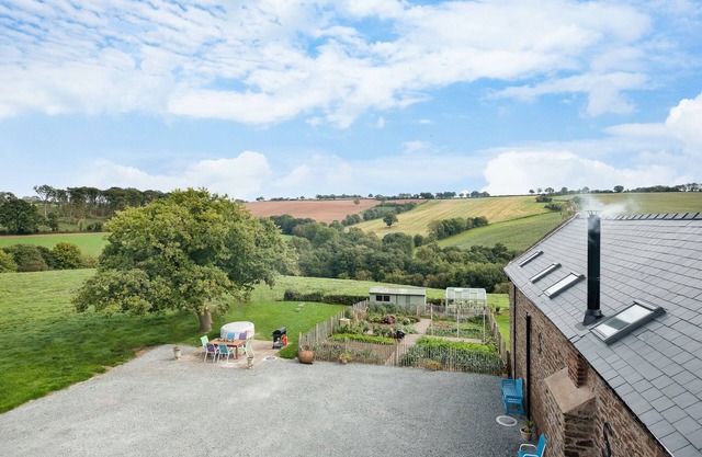 NEW Barn Conversion. Idyllic and unspoiled views complete with Hot Tub & Fire