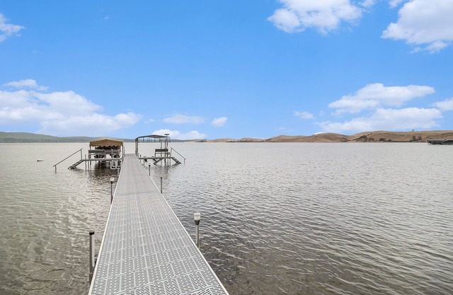 NEW LISTING: Beautiful cottage on the shores of Silver Lake with stunning water & dune views.