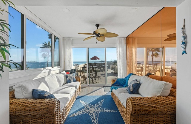 Oceanfront retreat with rooftop deck, modern interior, marble finishes, & W/D