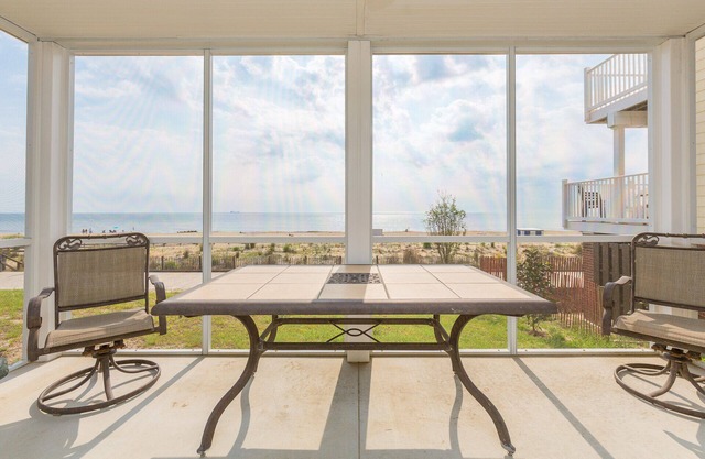 Oceanfront Unit in heart of Rehoboth Beach with covered porch front and back