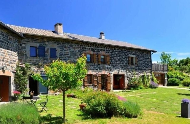 Old farm with covered terrace at the foot of Pic du Lizieux