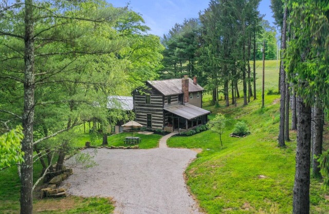 ONE OF A KIND HISTORIC LOG CABIN ON 10+ ACRES IN HOCKING HILLS