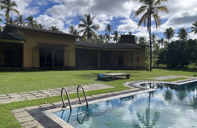 outdoor swimming pool with a picturesque garden for you to explore