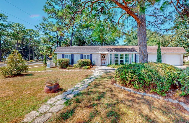 Parkside home with large yard, fireplace, sunroom, & W/D - near beach/downtown