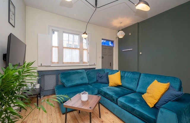 Pass the Keys | Airy 1850s Coach House with Private Balcony