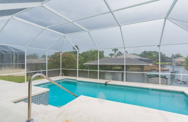 Peaceful Waterfront Pool Home by RedAwning