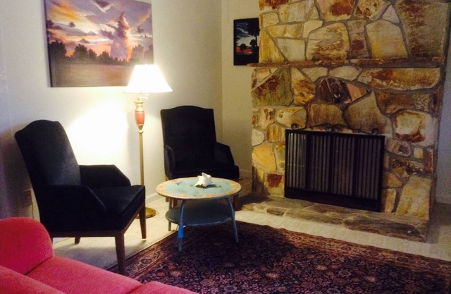 Pet-friendly, lovely home with large inground pool, live oaks and fenced yard.