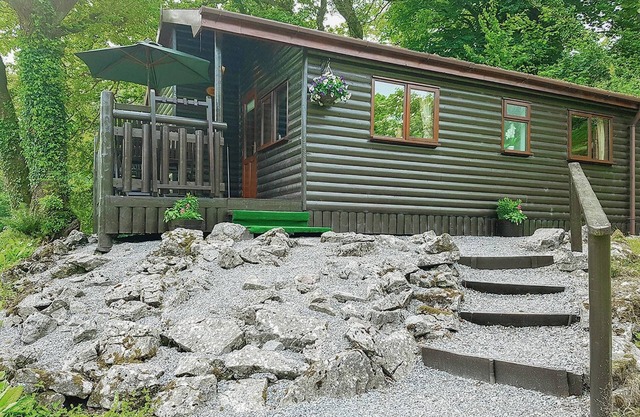 Pine log lodge with one double and one with bunks and a single.
