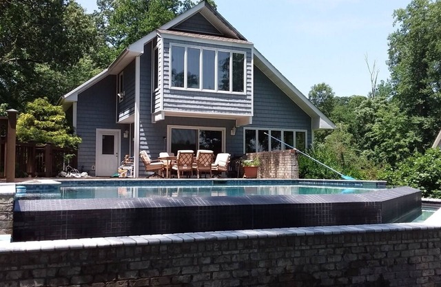 Private infinity pool, plus your own dock, kayaks, and bikes on the waterfront!