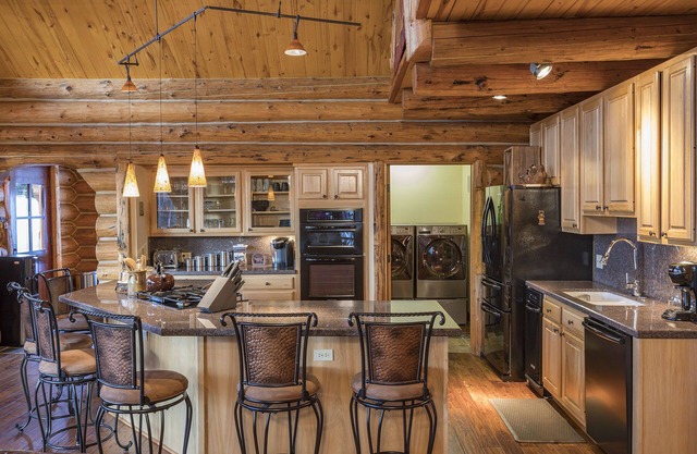 Private log home surrounded by aspen